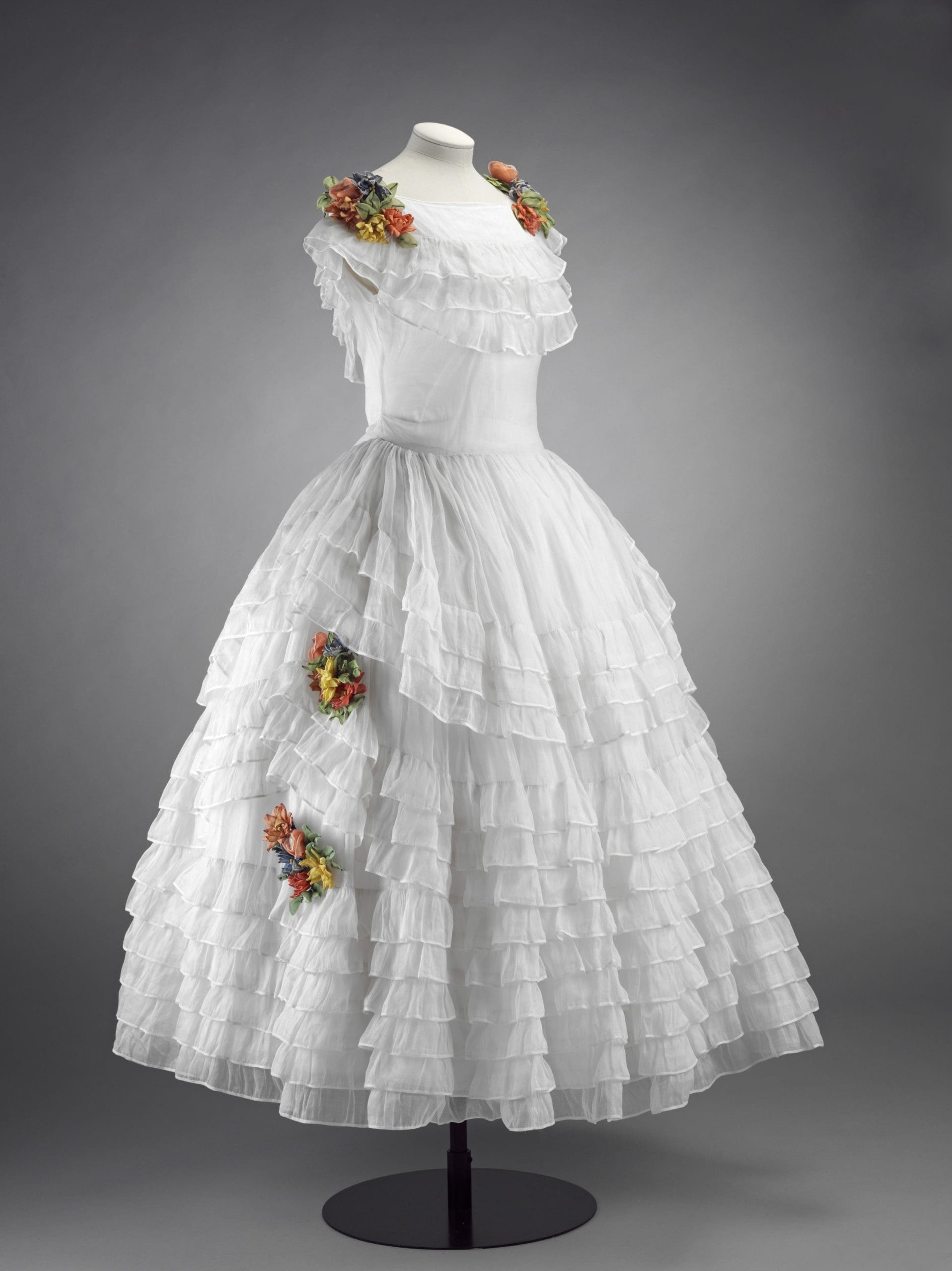 Dress, 'robe de style', white organza with artificial flowers, France © Victoria and Albert Museum, London.